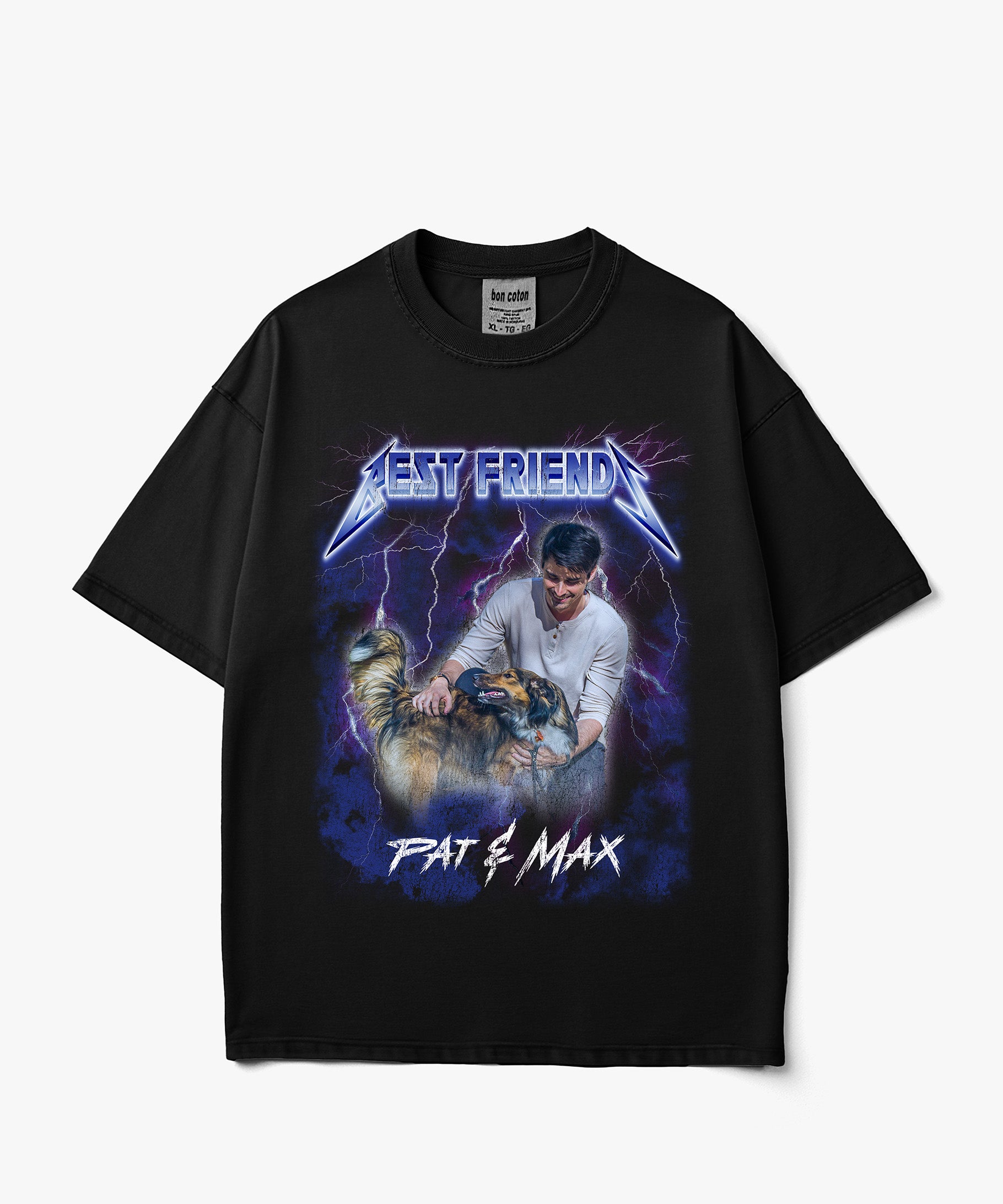 A black short-sleeve custom bootleg graphic t-shirt featuring a stylized Metallica-style band logo that reads 'BEST FRIEND' above an illustration of a man holding a chainsaw next to a cat, with 'PAT & MAX' written below, shown on a light gray background.