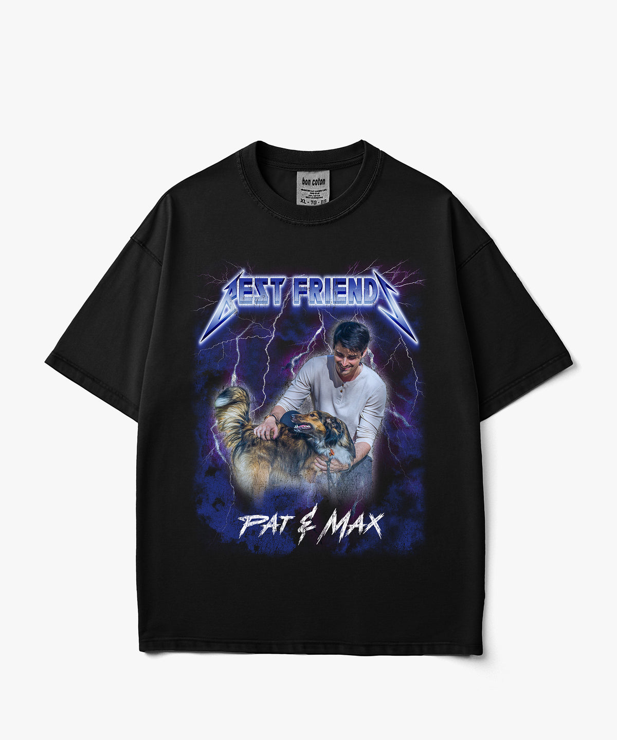 A black short-sleeve custom bootleg graphic t-shirt featuring a stylized Metallica-style band logo that reads 'BEST FRIEND' above an illustration of a man holding a chainsaw next to a cat, with 'PAT & MAX' written below, shown on a light gray background.