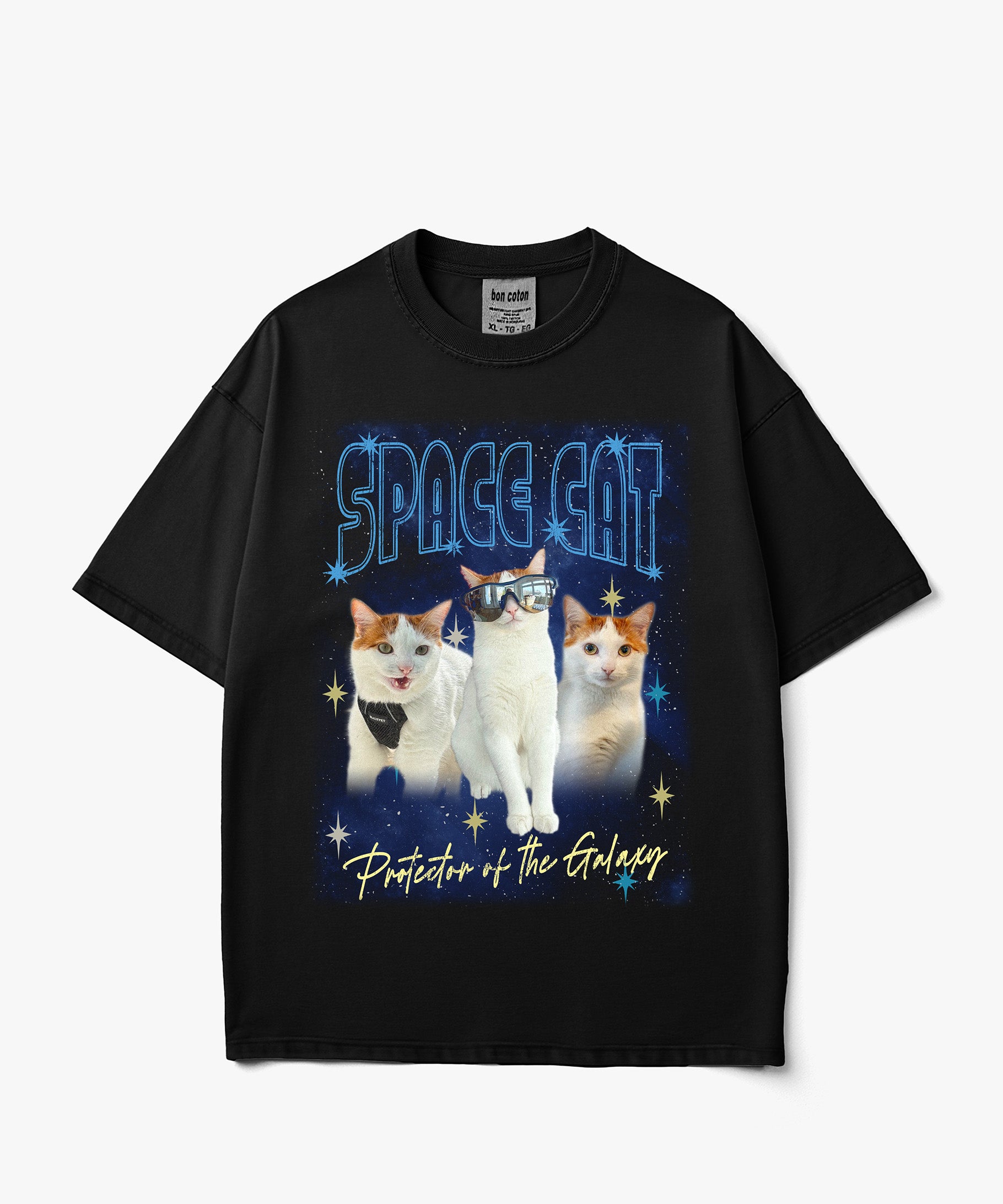 Image of A black short-sleeve custom bootleg graphic t-shirt featuring three cats dressed as space characters under the text 'SPACE CAT' and 'Protector of the Galaxy' on a light gray background.